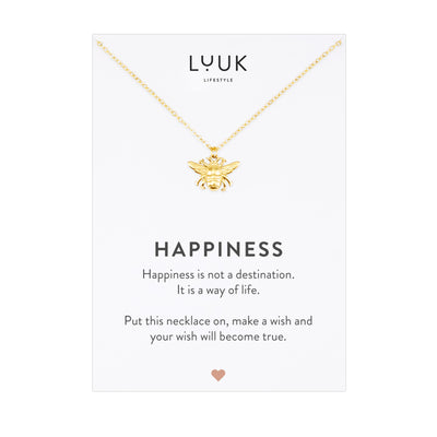 Goldene Halskette mit Bienen Anhänger auf Happiness Karte von der Brad Luuk Lifestyle