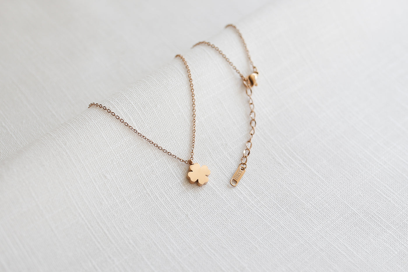 Necklace with clover leaf pendant and Happiness greeting card