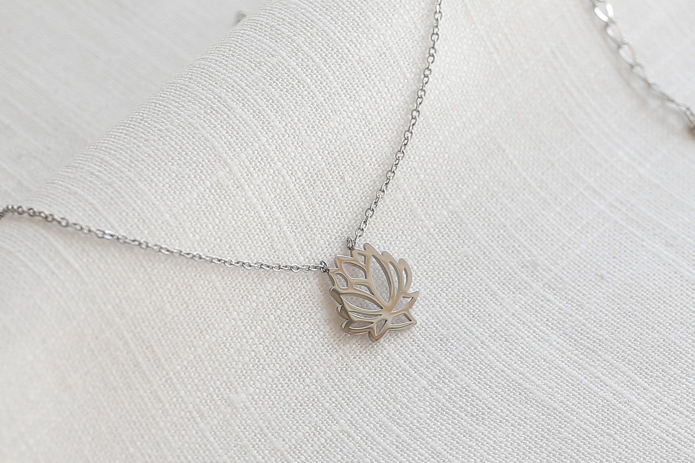 Necklace with lotus blossom pendant and Happiness greeting card