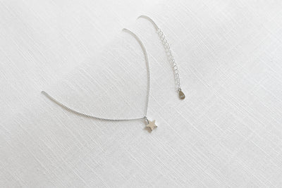 Sterling silver necklace with star pendant and Happiness greeting card