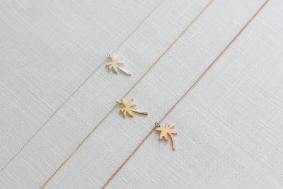 Damenschmuck mit Palmen Motiv aus Sterlingsilber in drei unterschiedlichen Farbkombinationen: Silber, Gold und Roségold 