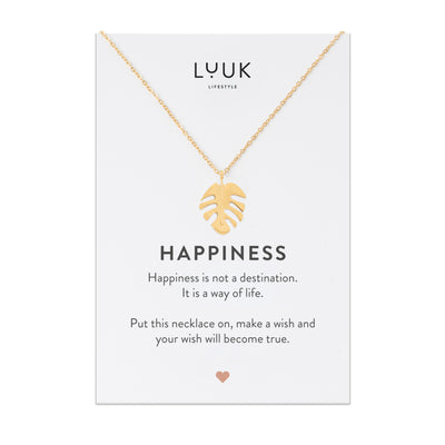 Gold Kette mit Monstera Blatt Anhänger auf Happiness Spruchkarte von der Brand Luuk Lifestyle