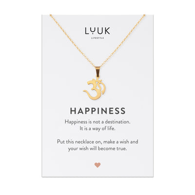 Goldene Halskette mit Om Anhänger auf Happiness Karte von der Brand Luuk Lifestyle.