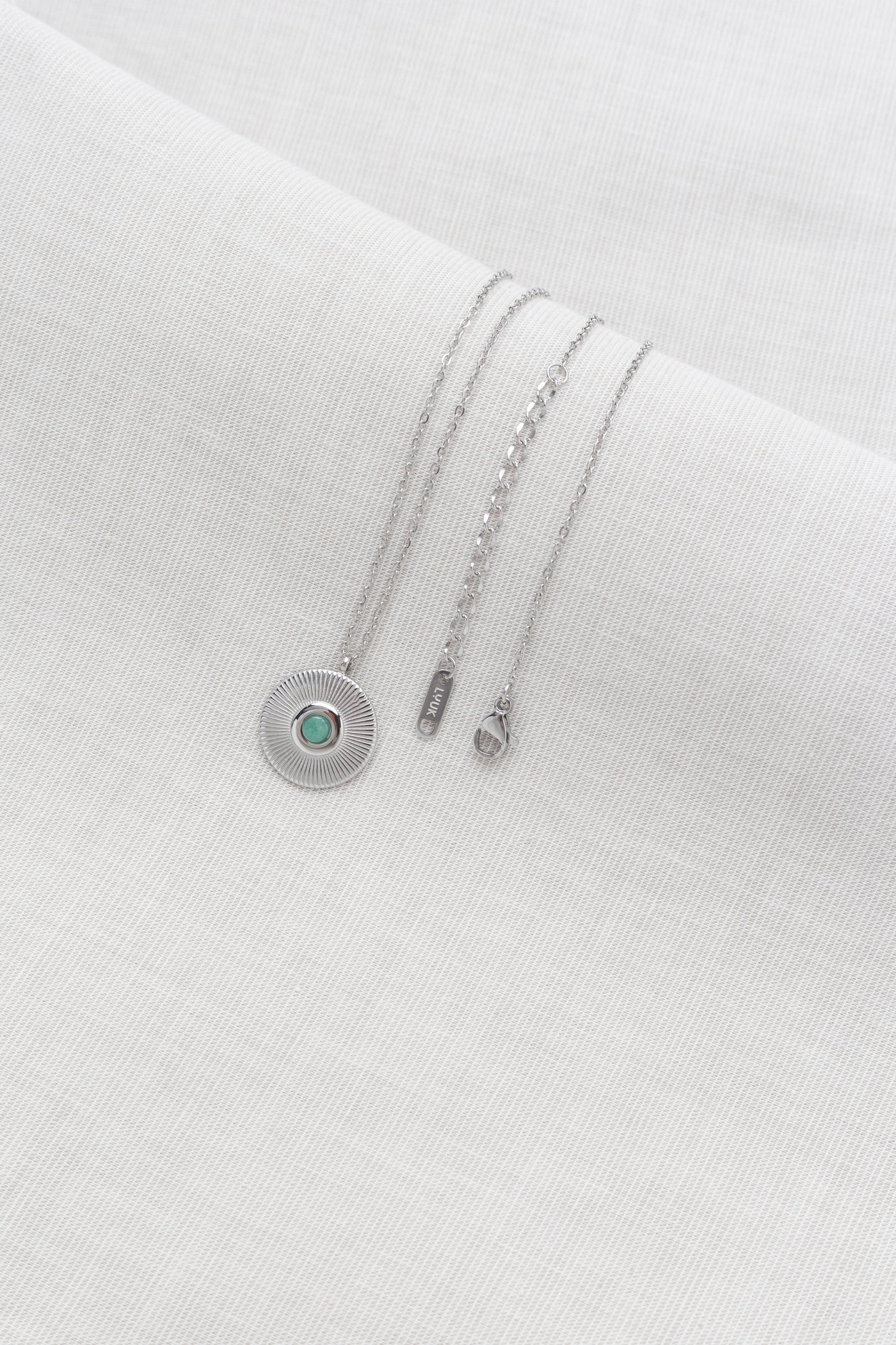 Kette Coin mit grünem Stein