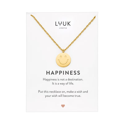 Goldene Halskette mit Smiley Anhänger auf Happiness Karte von der Brand Luuk Lifestyle.