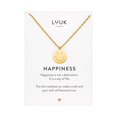 Goldene Halskette mit Smiley Anhänger auf Happiness Karte von der Brand Luuk Lifestyle.
